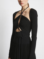 Detail image of model wearing Pleated Matte Jersey Halter Dress in BLACK