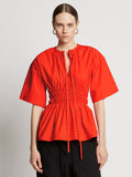 Front cropped image of model wearing Poplin Drawstring Blouse in BRIGHT ORANGE