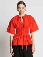 Front cropped image of model wearing Poplin Drawstring Blouse in BRIGHT ORANGE