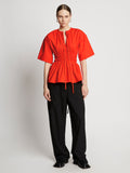 Front full length image of model wearing Poplin Drawstring Blouse in BRIGHT ORANGE