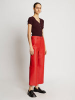 Side full length image of model wearing Leather Culottes in RED