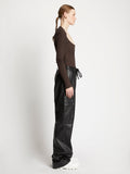 Side full length image of model wearing Plaited Rib Scoop Neck Sweater in BLACK/DARK BROWN