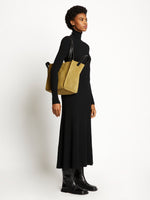 Image of model wearing Large Mercer Suede Tote in FATIGUE