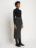 Side full length image of model wearing Lurex Rib Knit Skirt in BLACK/SILVER