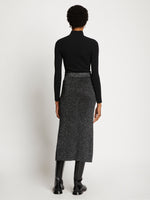 Back full length image of model wearing Lurex Rib Knit Skirt in BLACK/SILVER