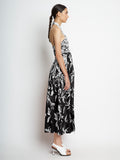 Side full length image of model wearing Dégradé Floral Halter Dress in BLACK/WHITE MULTI