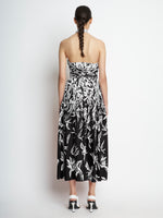 Back full length image of model wearing Dégradé Floral Halter Dress in BLACK/WHITE MULTI