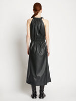 Back full length image of model wearing Faux Leather Drawstring Sleeveless Dress in BLACK