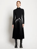 Front full length image of model wearing Lacquered Canvas Pleated Midi Skirt in BLACK