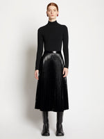 Front full length image of model wearing Lacquered Canvas Pleated Midi Skirt in BLACK