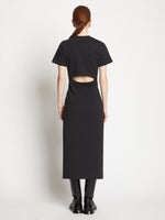 Back full length image of model wearing Short Sleeve Sweatshirt Dress in BLACK