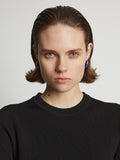 Image of model wearing mini hoop earrings in cobalt