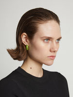 Image of model wearing mini hoop earrings in sulphur