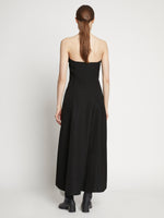 Back full length image of model wearing Matte Viscose Crepe Strapless Dress in BLACK