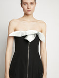 Detail image of model wearing Matte Viscose Crepe Strapless Dress in BLACK