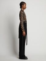 Side full length image of model wearing Leopard Crepe De Chine V-Neck Top in BROWN MULTI