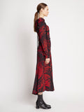 Side full length image of model wearing Painted Spiral Crepe De Chine Cinched Dress in RED MULTI