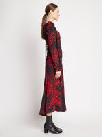 Side full length image of model wearing Painted Spiral Crepe De Chine Cinched Dress in RED MULTI