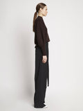 Side full length image of model wearing Eco Cashmere Balloon Sleeve Sweater in BROWN