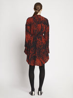 Back full length image of model wearing Leopard Crepe De Chine Shirt Dress in RED MULTI