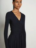 Detail image of model wearing Matte Crepe Wrap Dress in BLACK