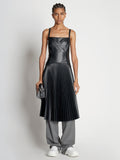 Front full length image of model wearing Drop Waist Faux Leather Dress in BLACK