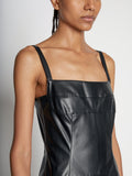 Detail image of model wearing Drop Waist Faux Leather Dress in BLACK