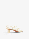 3/4 Back image of Sculpt Sandals in Light/Pastel Yellow