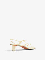 3/4 Back image of Sculpt Sandals in Light/Pastel Yellow