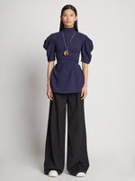 Front full length image of model wearing Matte Viscose Crepe Belted Top in NAVY