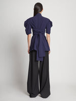 Back full length image of model wearing Matte Viscose Crepe Belted Top in NAVY