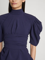 Detail image of model wearing Matte Viscose Crepe Belted Top in NAVY