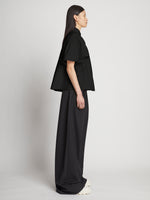 Side full length image of model wearing Poplin Pintuck Top in BLACK