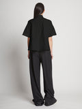 Back full length image of model wearing Poplin Pintuck Top in BLACK