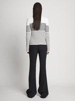 Back full length image of model wearing Boucle Mini Stripe Sweater in OFF WHITE MULTI