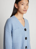 Detail image of model wearing Eco Cashmere Cardigan in LIGHT BLUE