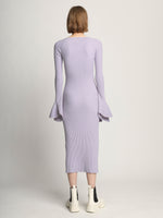 Back full length image of model wearing Fluted Rib Knit Dress in LAVENDER