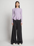 Front full length image of model wearing Fluted Rib Knit Peplum Sweater in LAVENDER