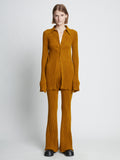 Front full length image of model wearing Velvet Rib Knit Pants in OCHRE