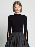 Front cropped image of model wearing Matte Viscose Knit Fringe Sweater in BLACK