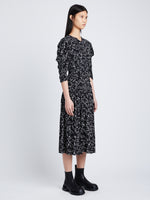 Side image of model wearing Printed Crepe De Chine Dress in black/white multi