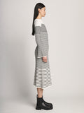 Side image of model wearing Boucle Mini Stripe Knit Dress in off white multi