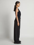 Side image of model wearing Matte Viscose Crepe Spiral Top in navy