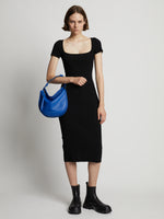 Image of model wearing Medium Baxter Leather Bag in COBALT