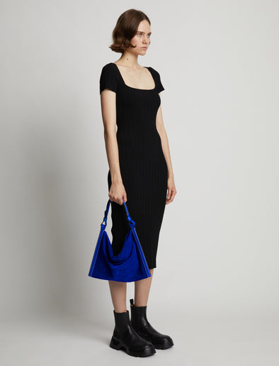 Image of model wearing Minetta Suede Bag in COBALT