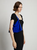 Image of model wearing Minetta Suede Bag in COBALT