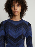 Detail image of model wearing Marled Stripe Knit Sweater in cerulean/black