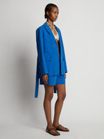 Side image of model wearing Cotton Linen Blazer in cerulean