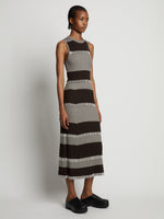 Side image of model wearing Mini Stripe Sleeveless Knit Dress in dark brown/off white