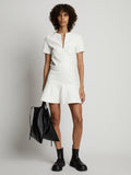 Front image of model wearing Faux Leather Ruffle Mini Dress in off white